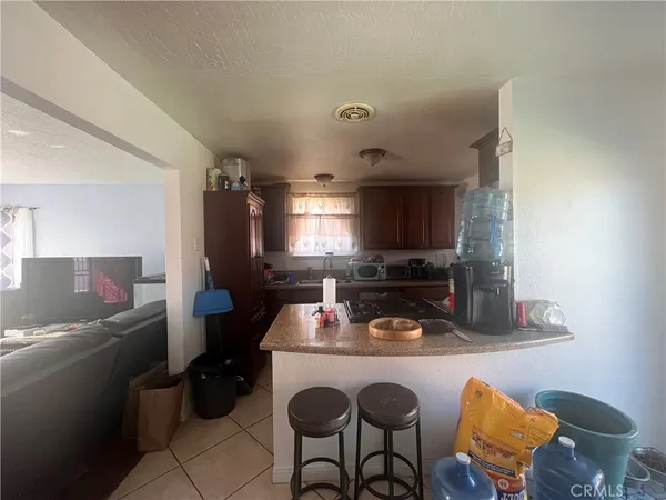 a kitchen with a sink cabinets and appliances