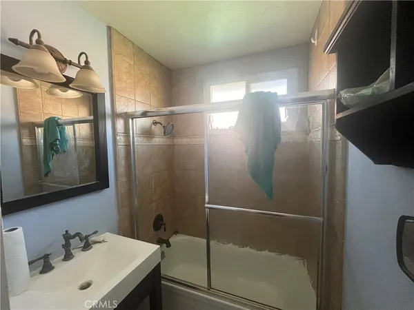 a bathroom with a sink and mirror