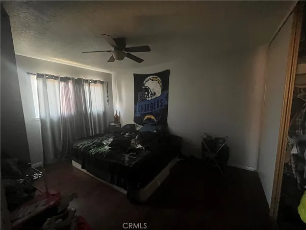 a bed sitting in a room next to a window
