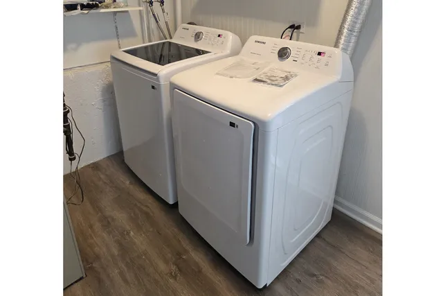 a utility room with washer and dryer