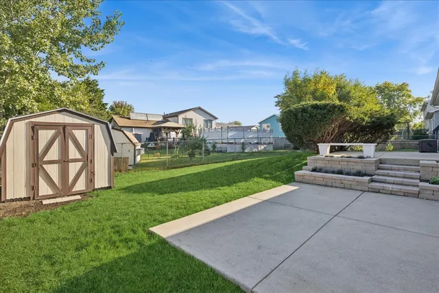 a view of backyard with a garden and entertaining space
