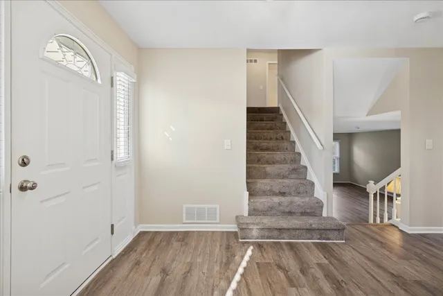 a view of entryway with wooden floor