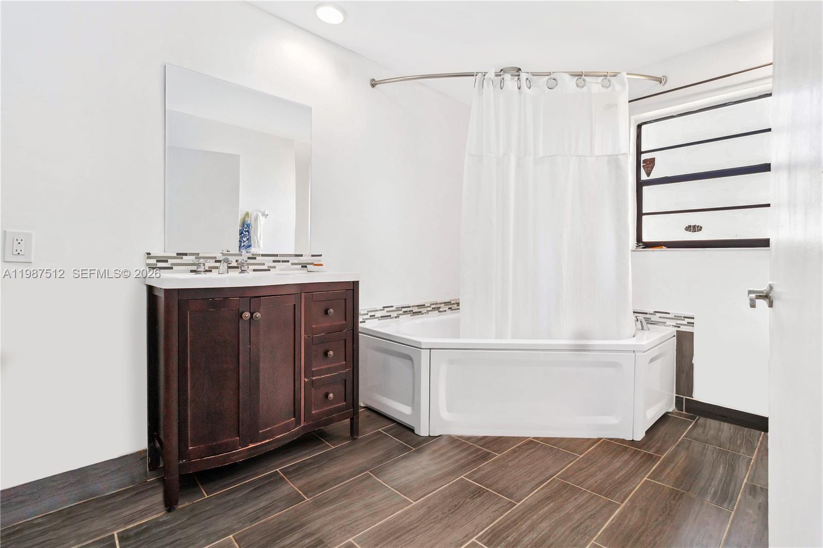 14461 Southwest 285th Street Homestead, FL 33033 - Photo 15 of 17 a view of a kitchen with cabinets and wooden floor