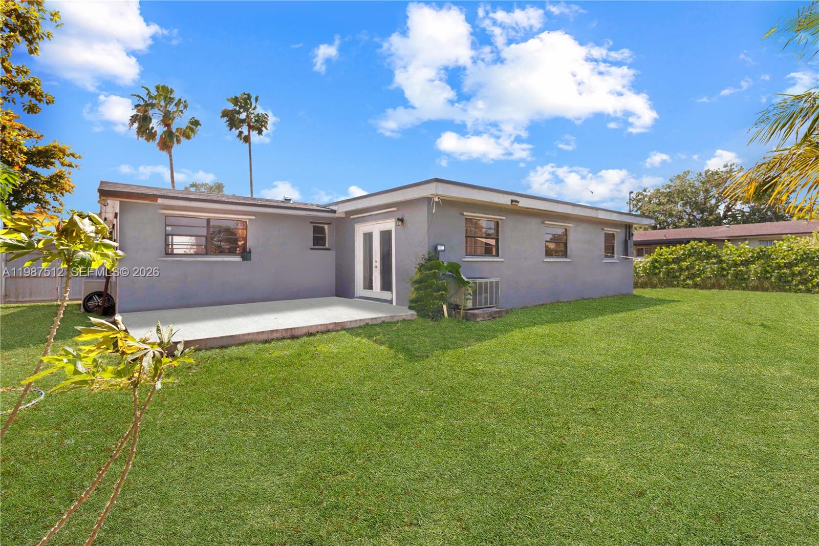 14461 Southwest 285th Street Homestead, FL 33033 - Photo 16 of 17 a view of a house with a backyard