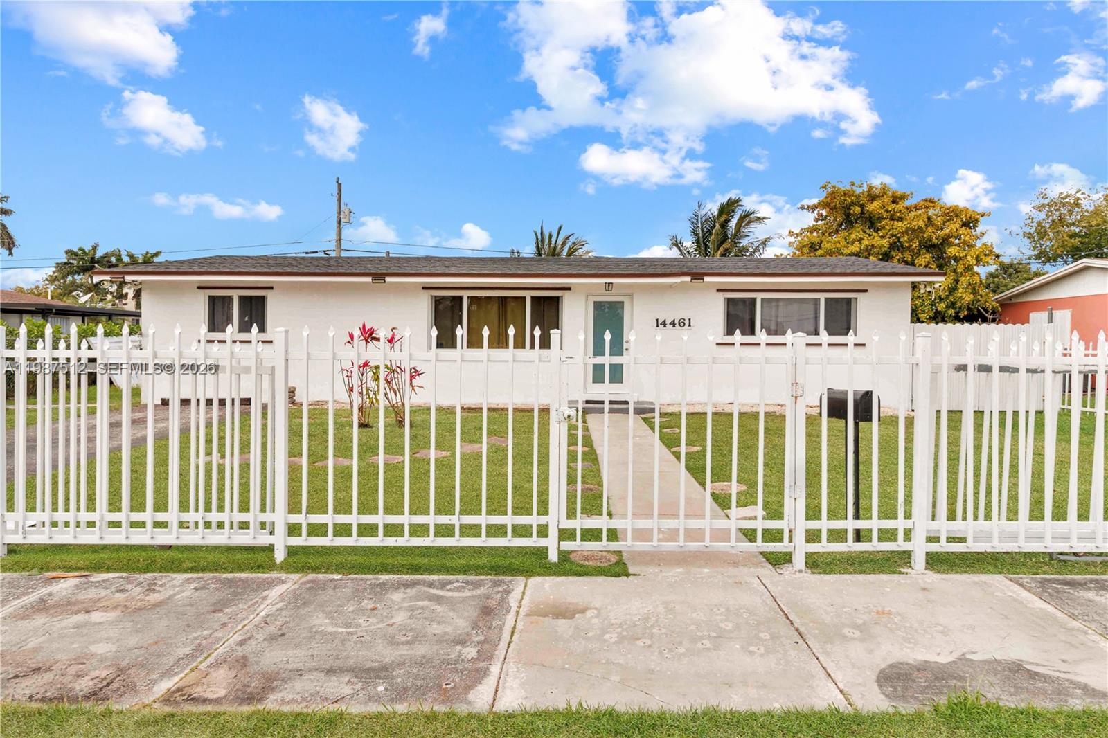14461 Southwest 285th Street Homestead, FL 33033 - Photo 2 of 17 a view of a house with a yard and a garden