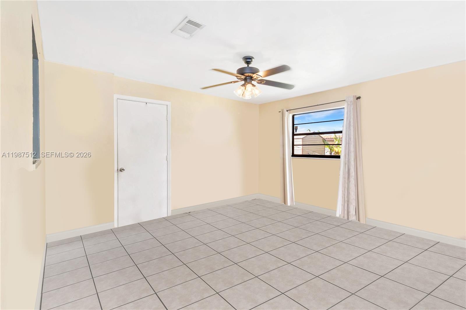 14461 Southwest 285th Street Homestead, FL 33033 - Photo 5 of 17 a view of empty room with ceiling fan