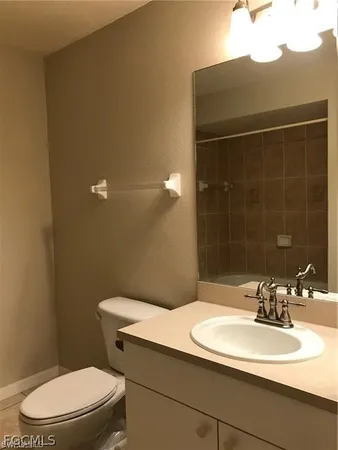 a white bath tub and a shower