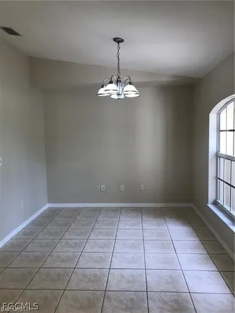 a kitchen with stainless steel appliances a refrigerator sink and microwave