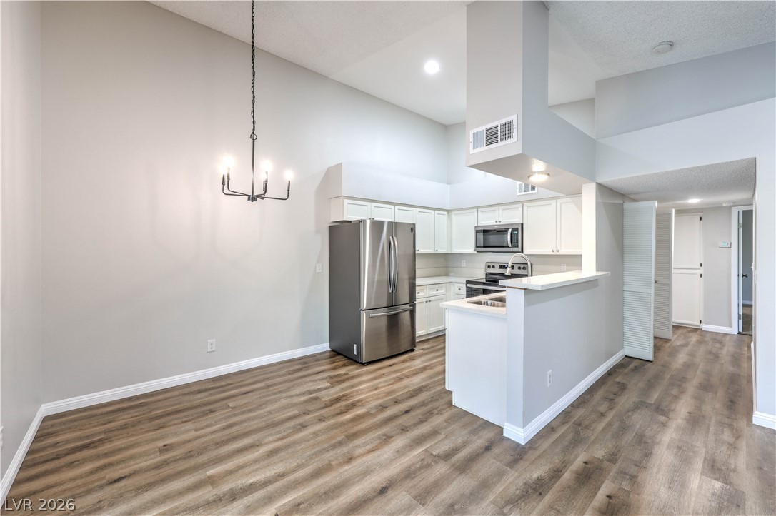 1575 West Warm Springs Road, Unit 322 Henderson, NV 89014 - Photo 9 of 25 Bright and open-concept kitchen featuring clean lines and modern finishes.
