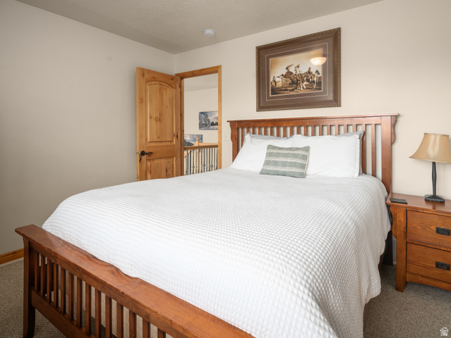 5184 Fairview Loop Eden, UT 84310 - Photo 33 of 54 Spacious room featuring neutral wall tones, a solid wood paneled door, and a built-in recessed light fixture
