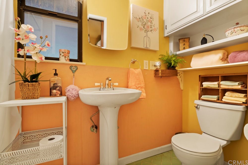 18777 Walnut Road Castro Valley, CA 94546 - Photo 13 of 68 a bathroom with a sink toilet and mirror