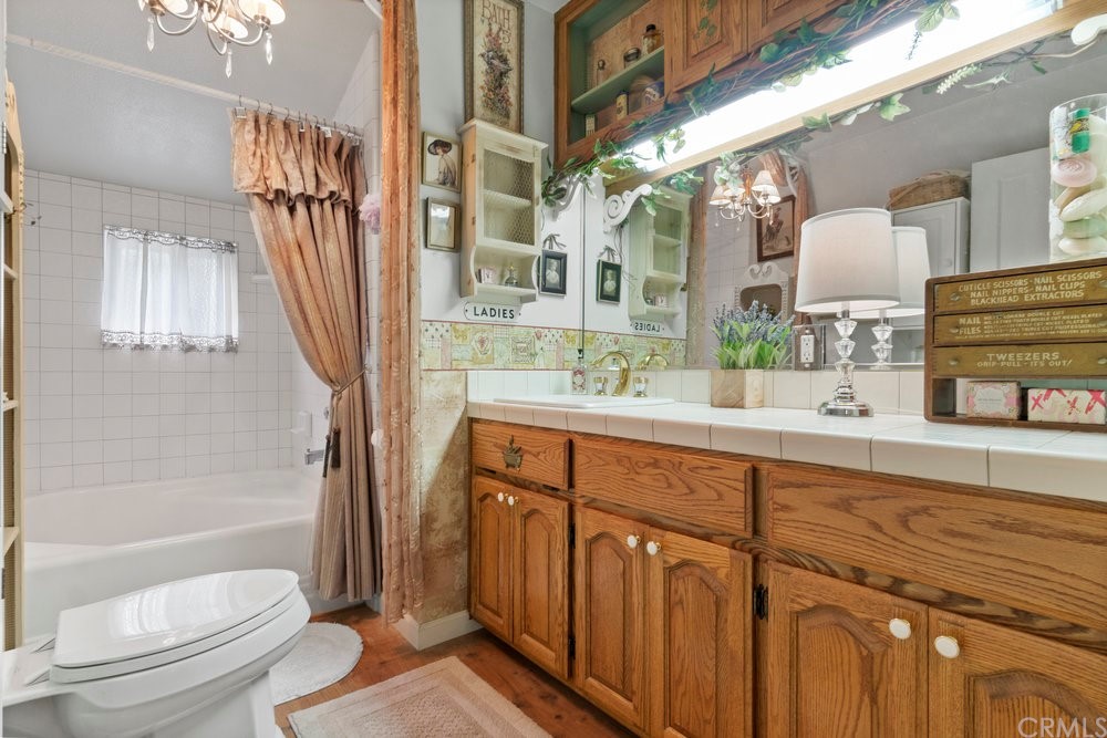 18777 Walnut Road Castro Valley, CA 94546 - Photo 36 of 68 a bathroom with a double vanity sink toilet mirror and bathtub