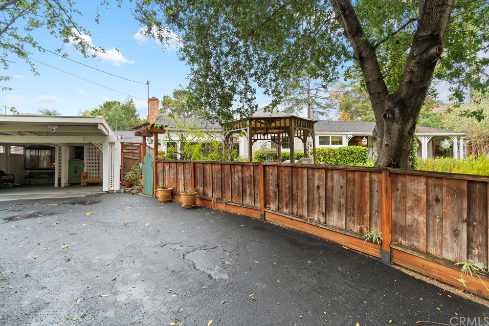 18777 Walnut Road Castro Valley, CA 94546 - Photo 6 of 68 a view of a house with wooden fence next to a road