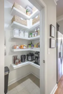 a cabinet with kitchen island