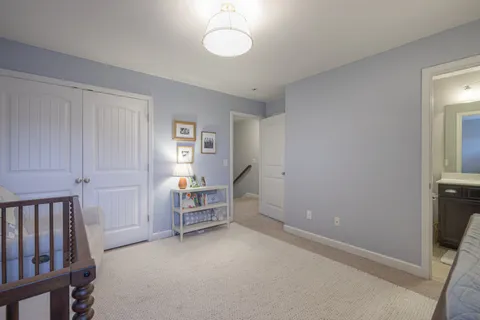 a view of room with window and wooden floor