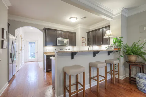a kitchen with granite countertop counter top space and stainless steel appliances