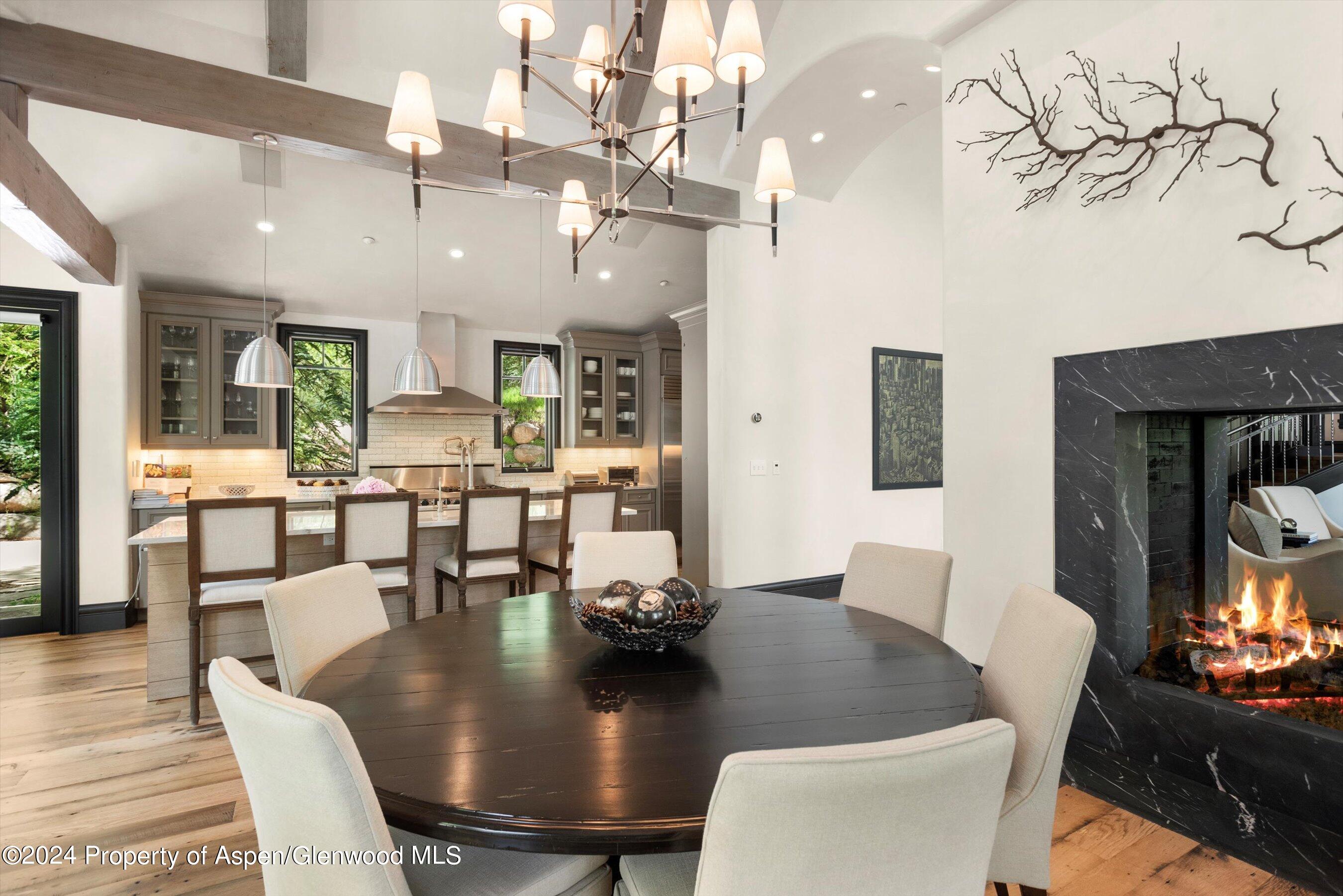 27 Nighthawk Drive Aspen, CO 81611 - Photo 16 of 61 a view of a dining room with furniture and wooden floor