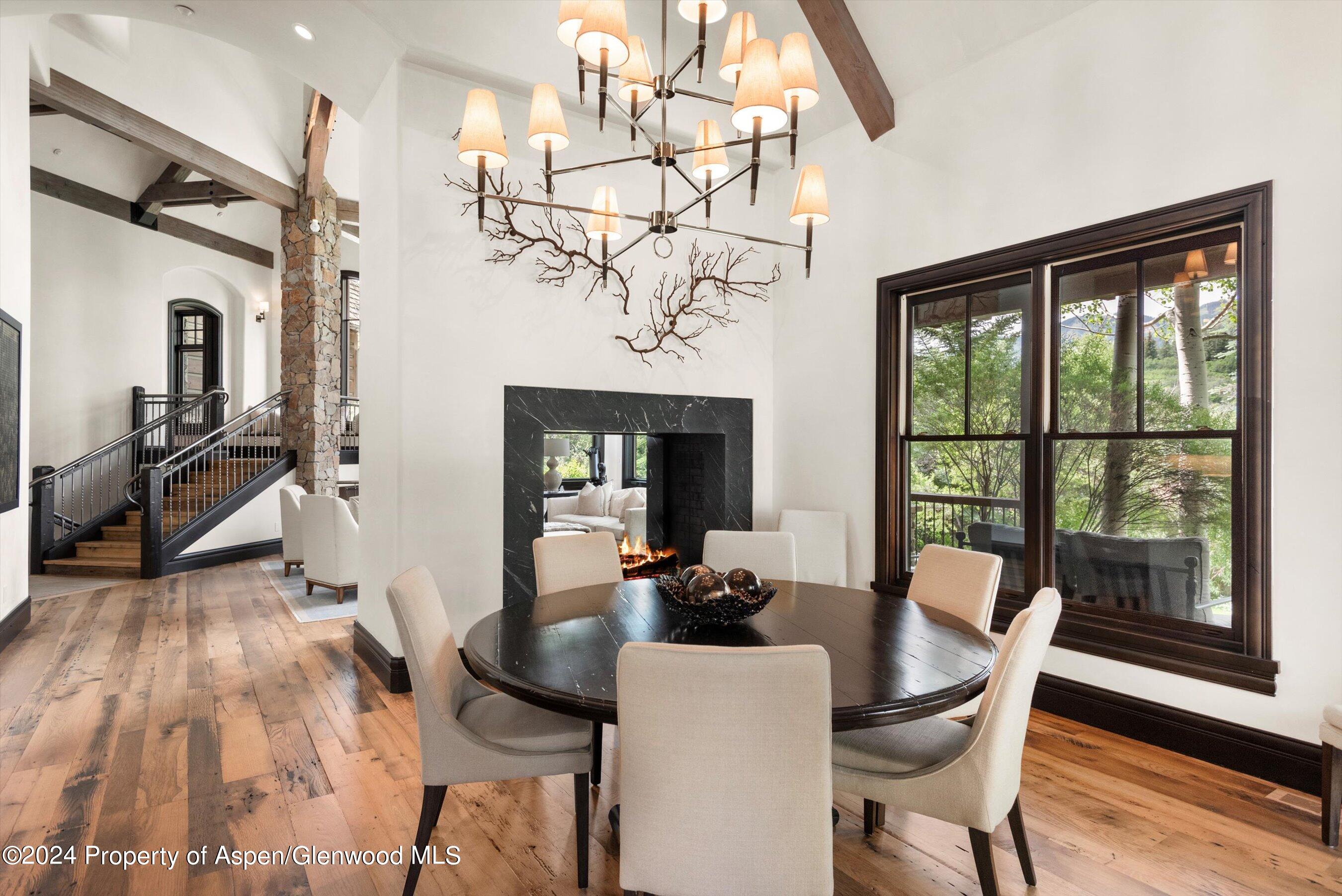 27 Nighthawk Drive Aspen, CO 81611 - Photo 17 of 61 a view of a dining room with furniture window and wooden floor