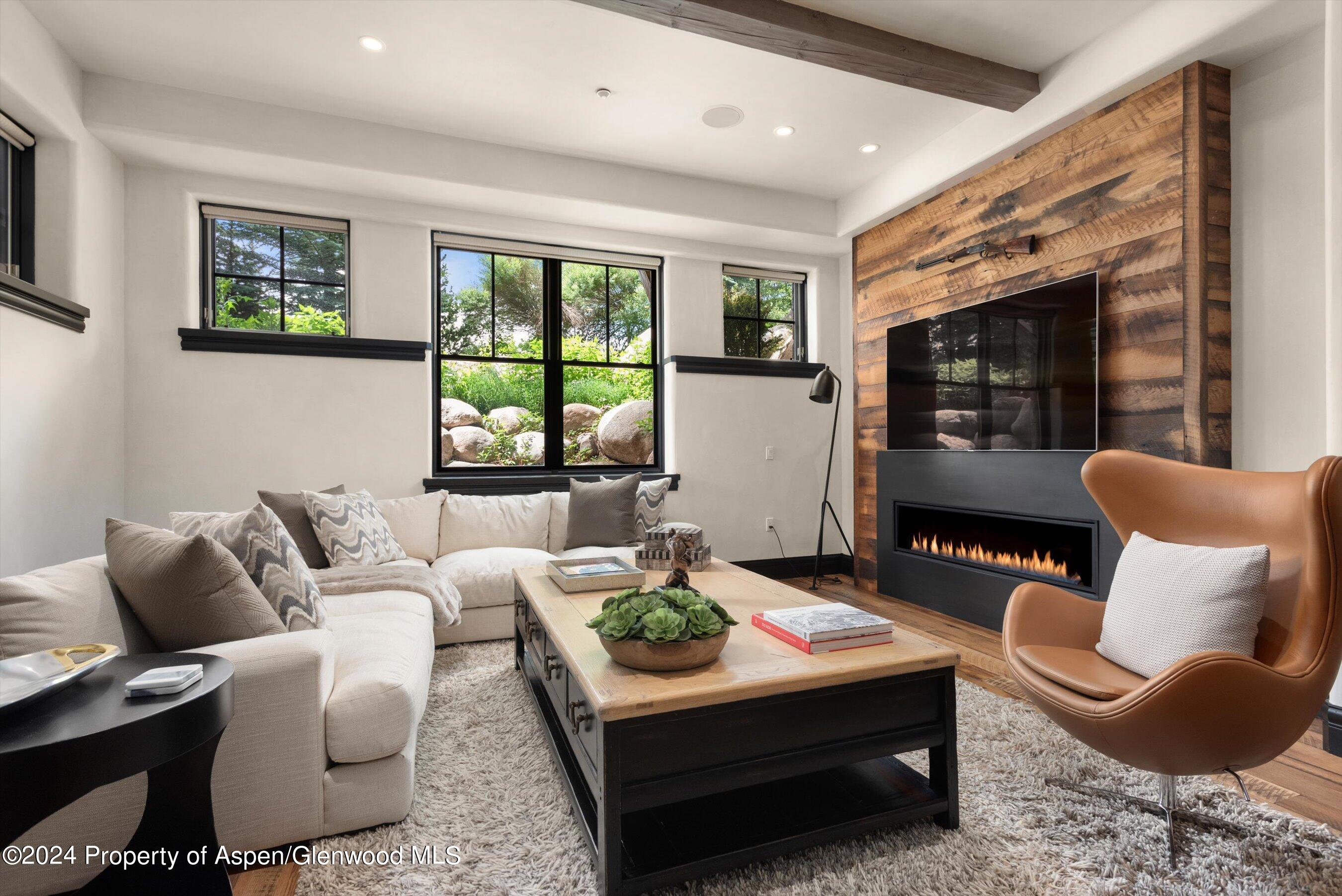 27 Nighthawk Drive Aspen, CO 81611 - Photo 25 of 61 a living room with furniture potted plant and a large window