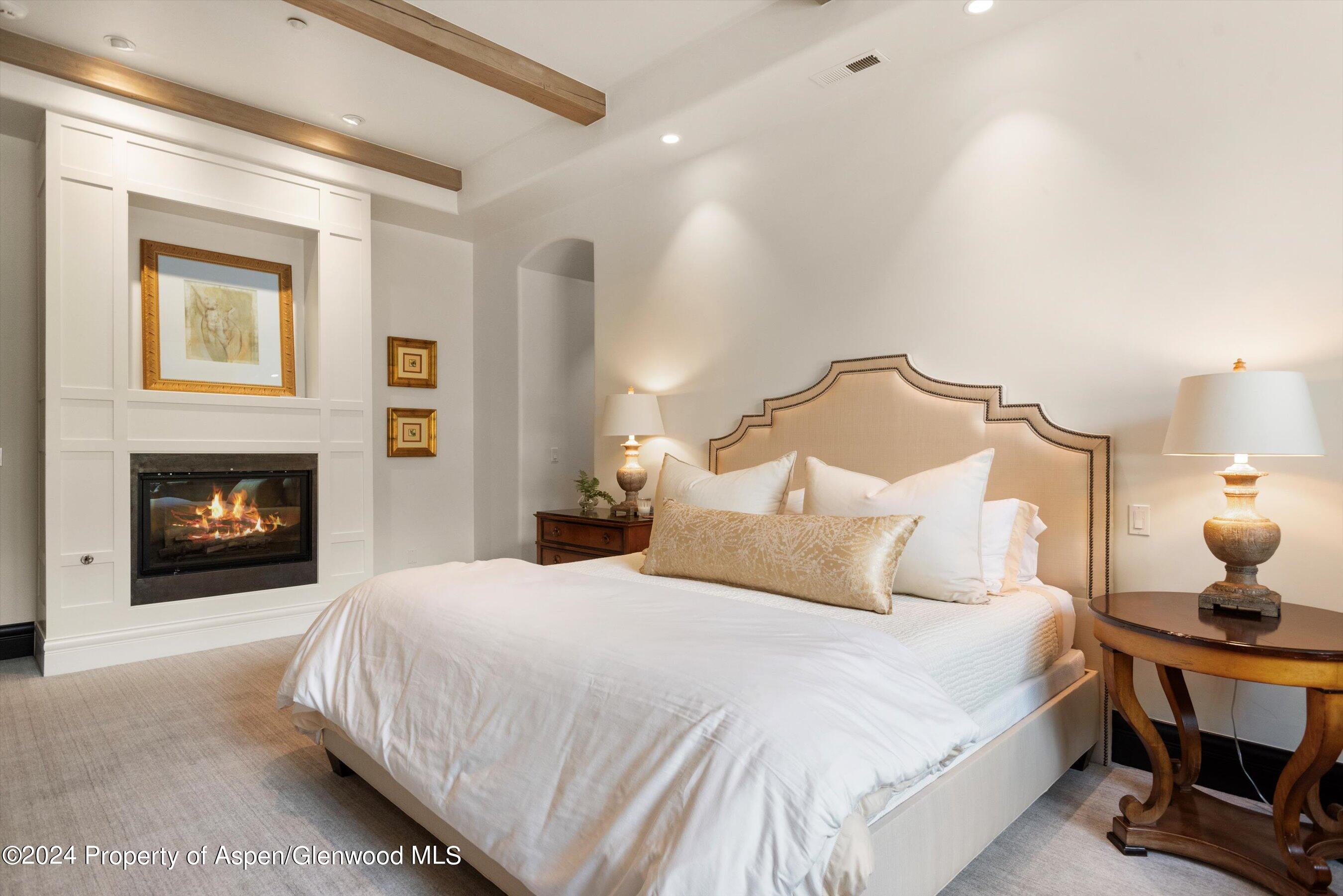 27 Nighthawk Drive Aspen, CO 81611 - Photo 30 of 61 a bedroom with a bed and a fireplace