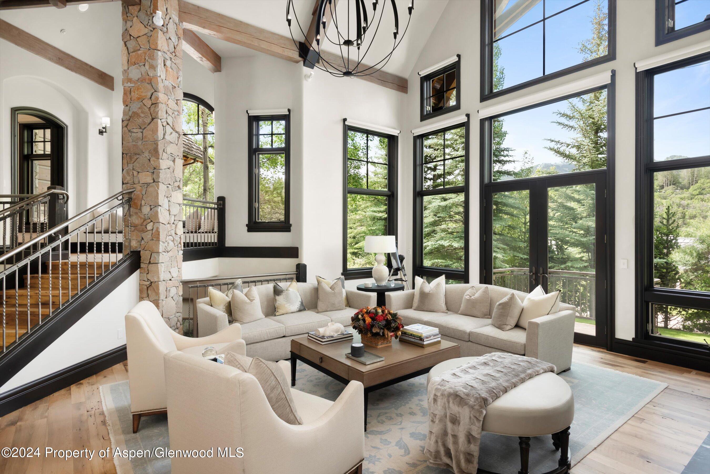 27 Nighthawk Drive Aspen, CO 81611 - Photo 3 of 61 a living room with furniture and floor to ceiling windows