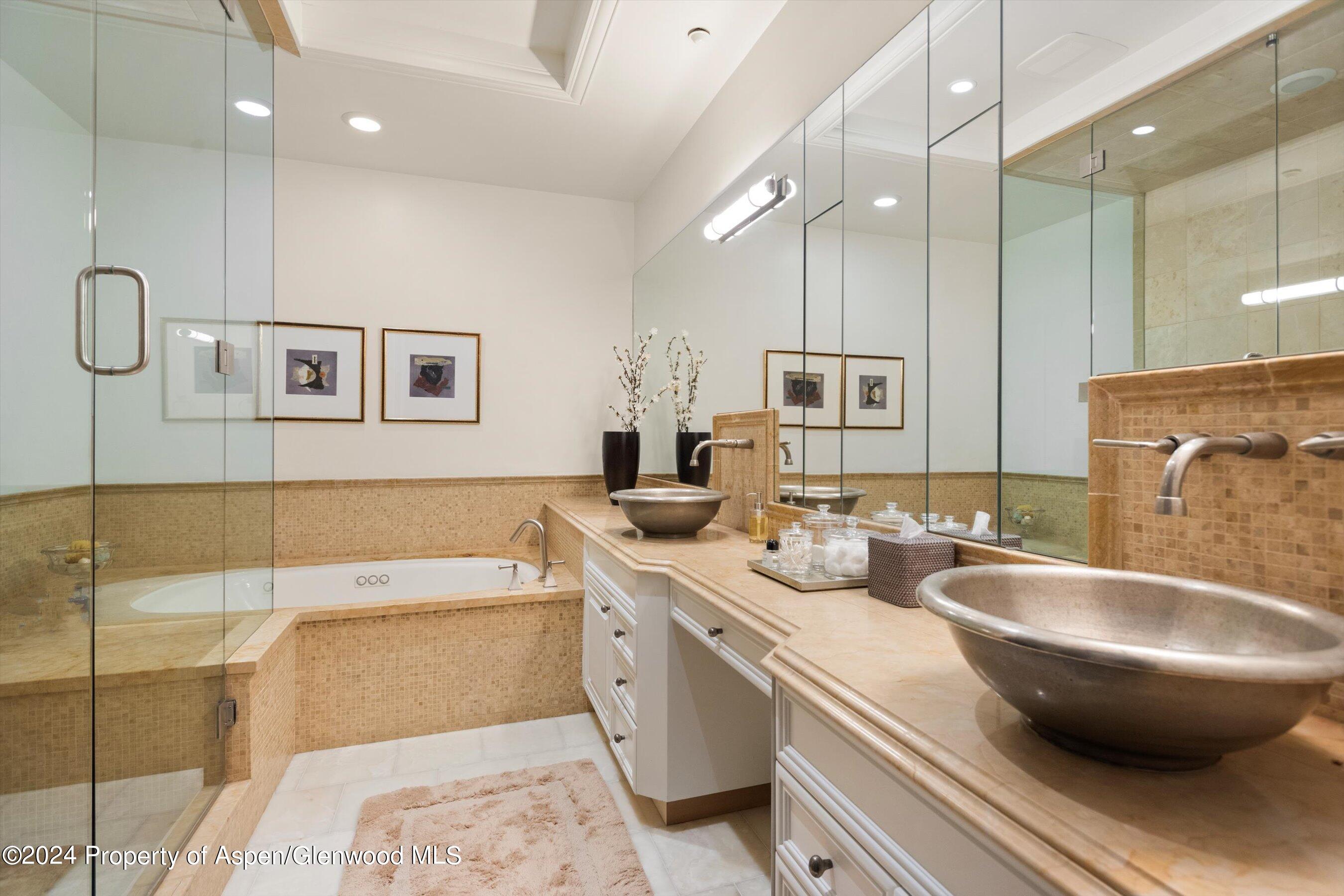 27 Nighthawk Drive Aspen, CO 81611 - Photo 31 of 61 a bathroom with a tub sink and mirror
