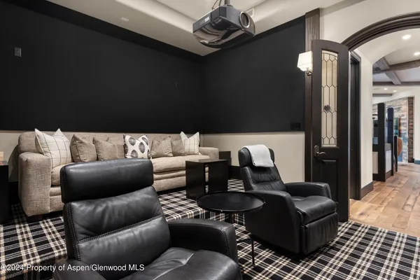 a bathroom with a sink vanity granite shower and a mirror