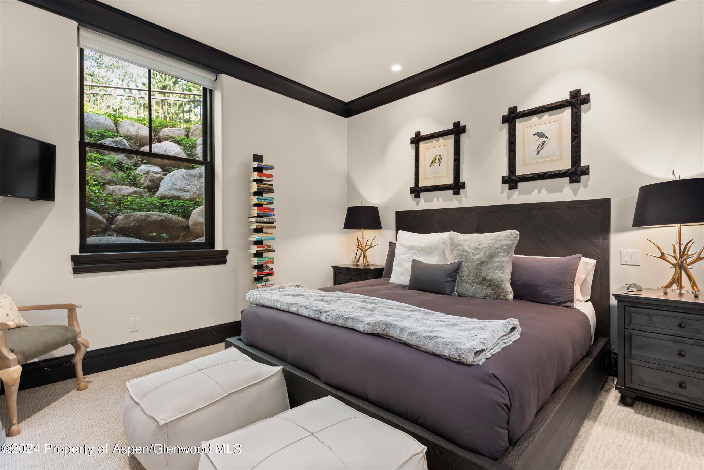 27 Nighthawk Drive Aspen, CO 81611 - Photo 34 of 61 a bedroom with a large bed and a window