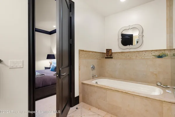 a patio with a patio table and chairs