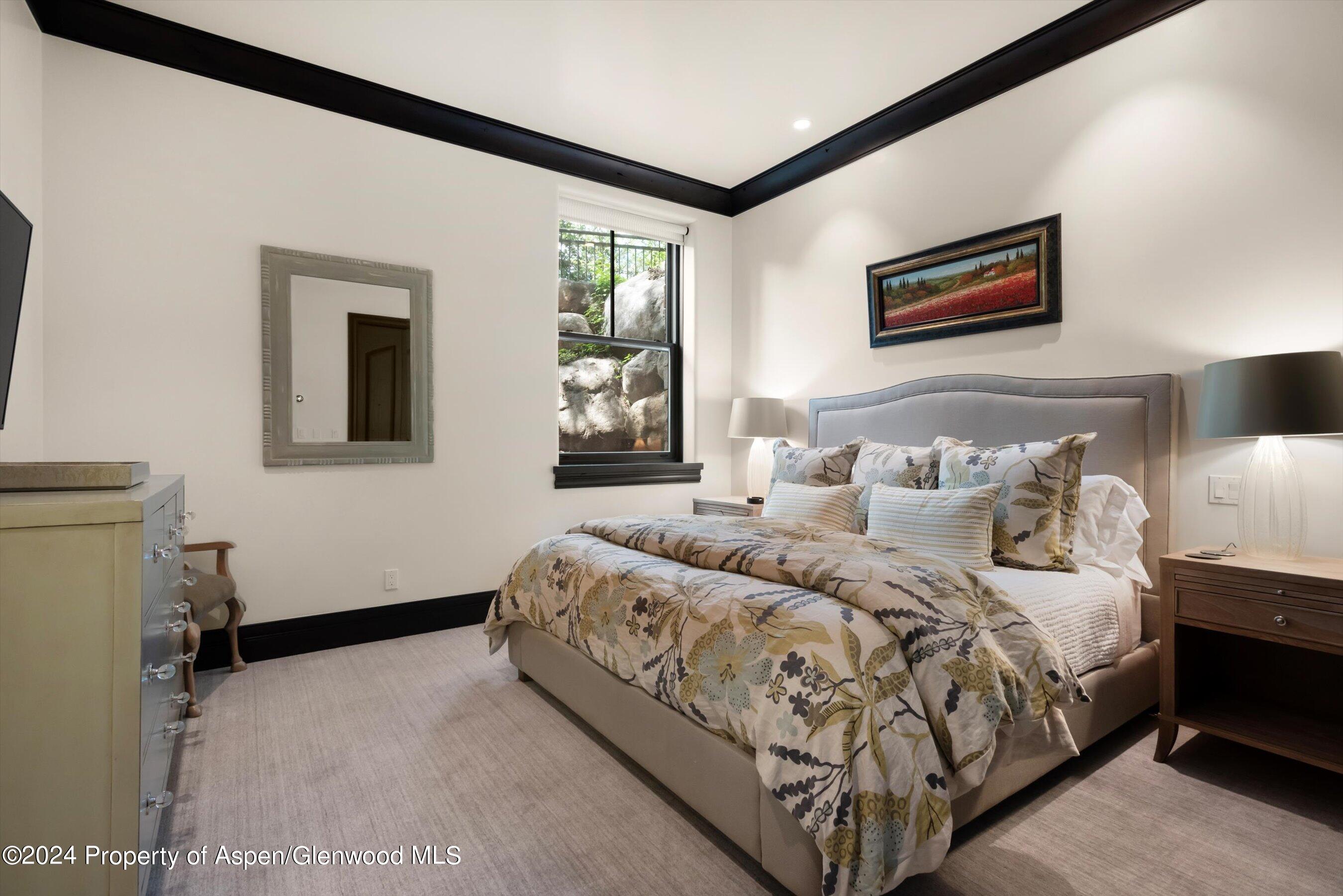 27 Nighthawk Drive Aspen, CO 81611 - Photo 37 of 61 a bedroom with bed and a window