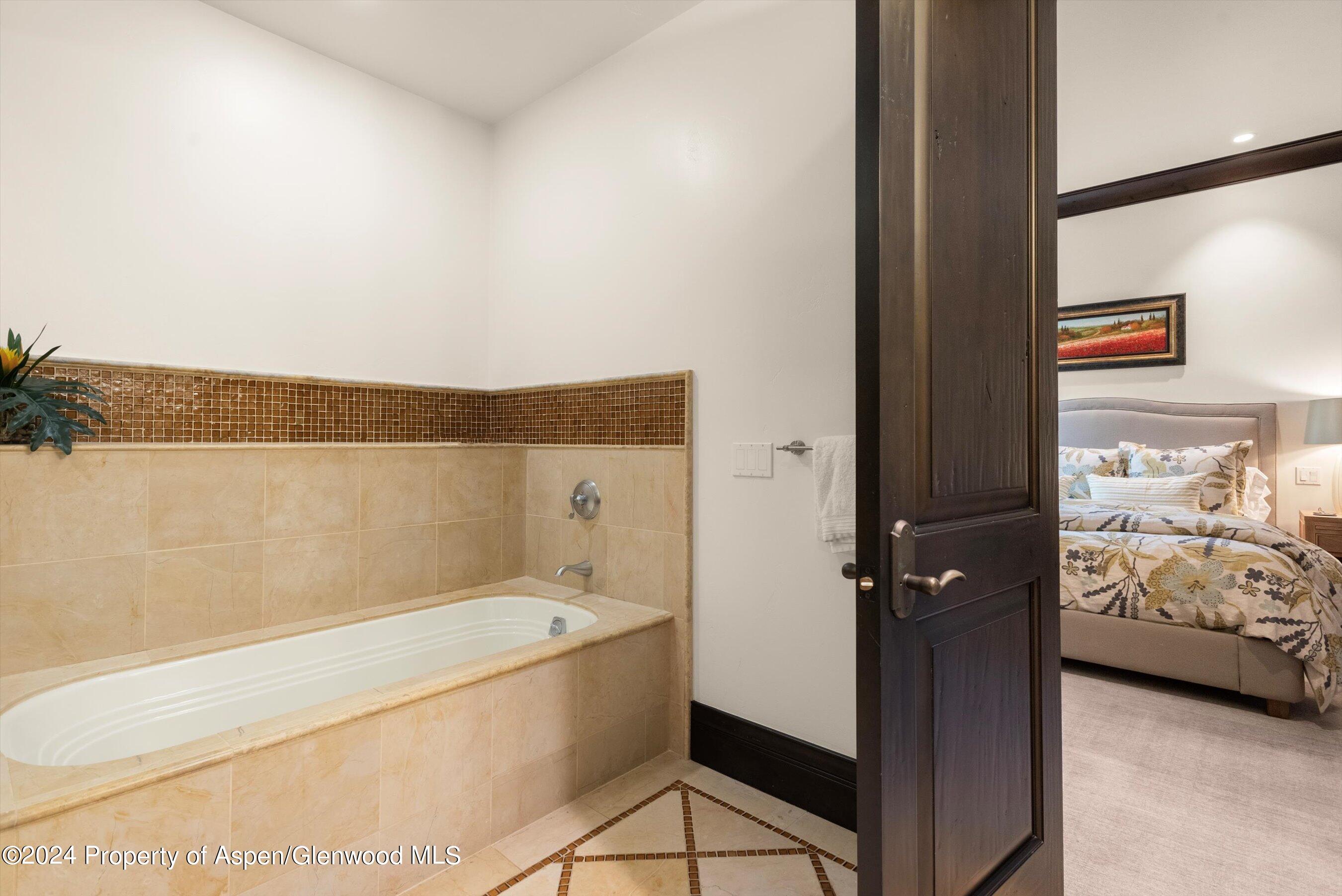 27 Nighthawk Drive Aspen, CO 81611 - Photo 39 of 61 a bathroom with a bathtub and a shower