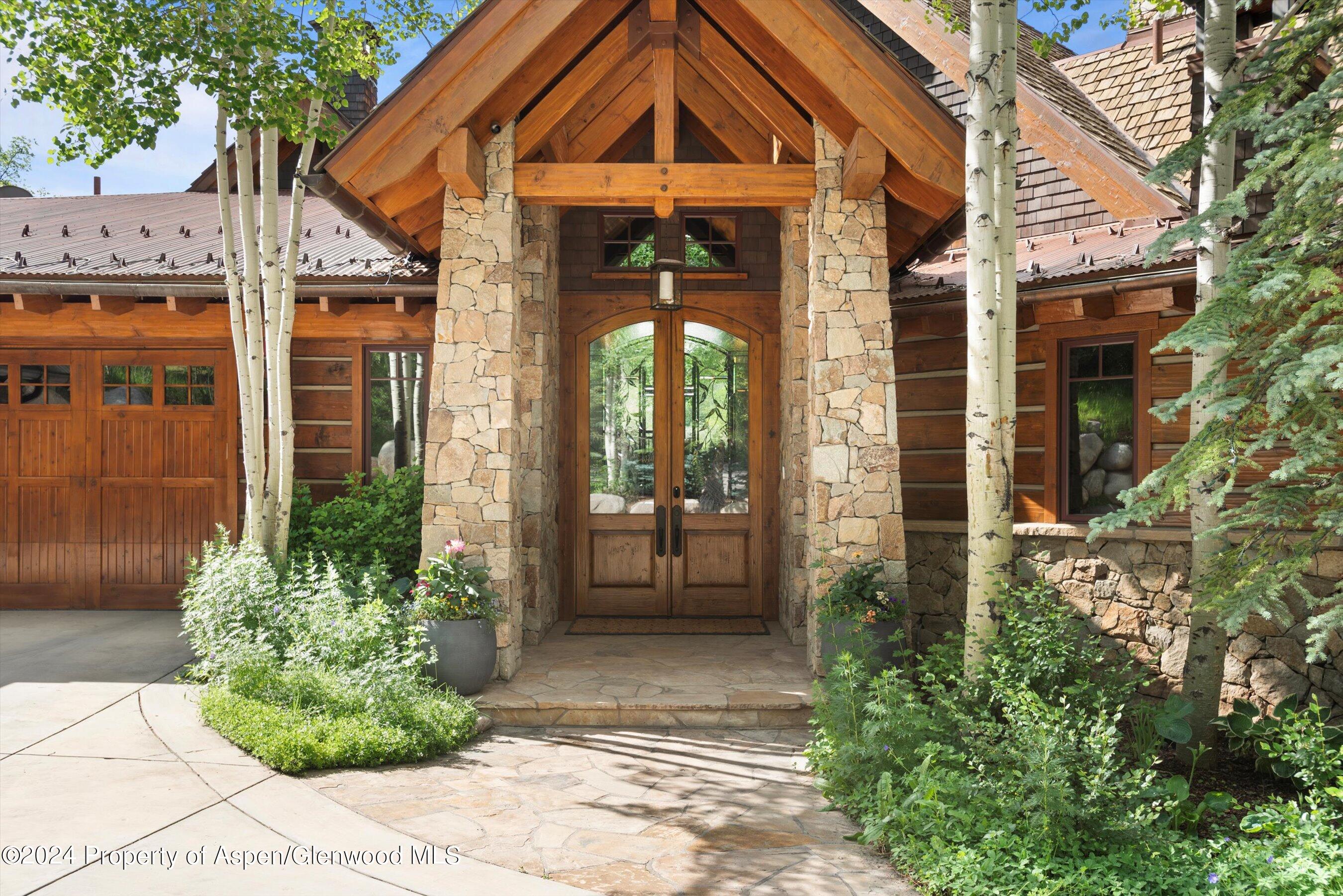 27 Nighthawk Drive Aspen, CO 81611 - Photo 41 of 61 a front view of a house with garden