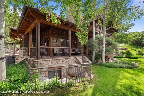 a view of a house with a mountain in the background