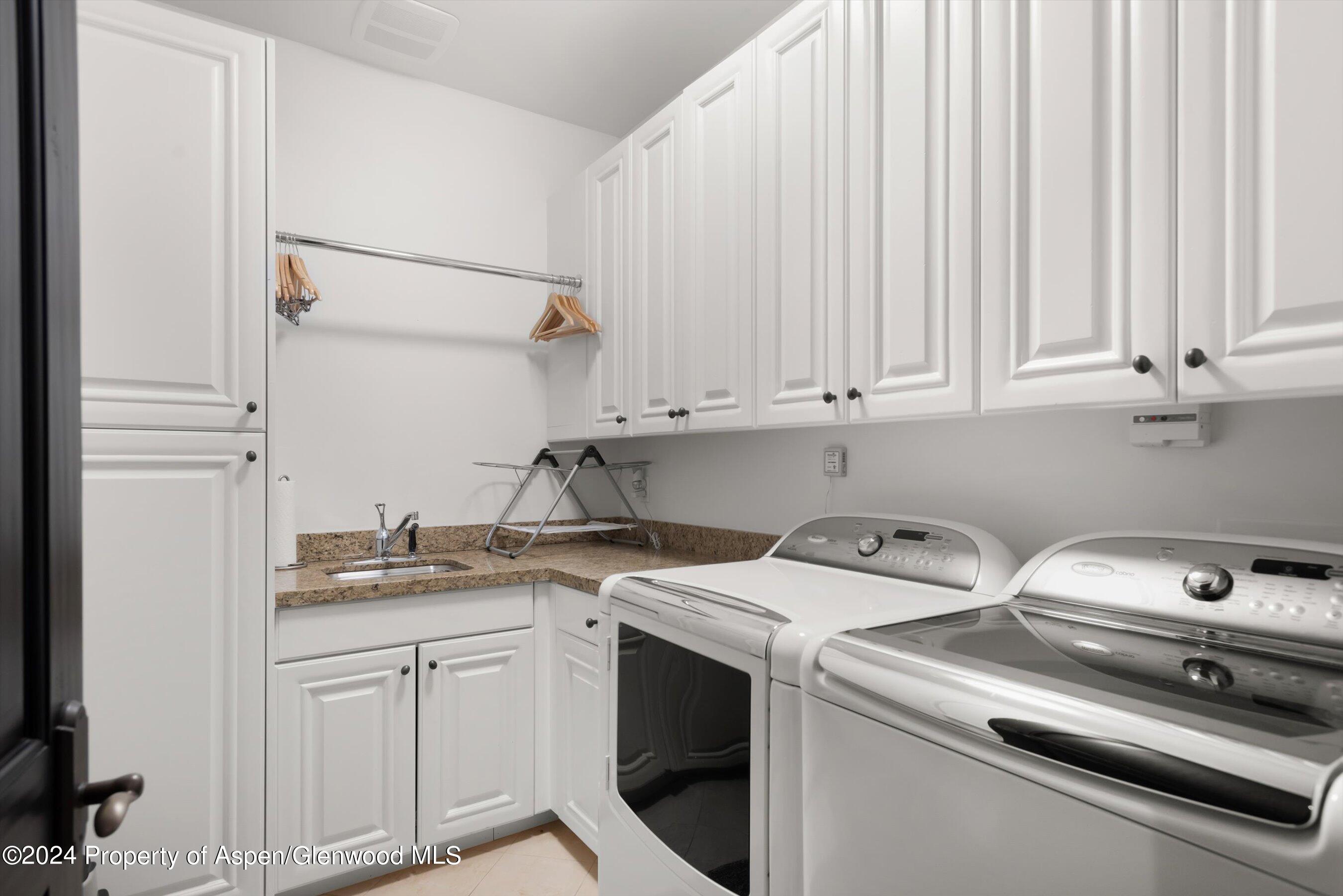 27 Nighthawk Drive Aspen, CO 81611 - Photo 50 of 61 a utility room with dryer and washer