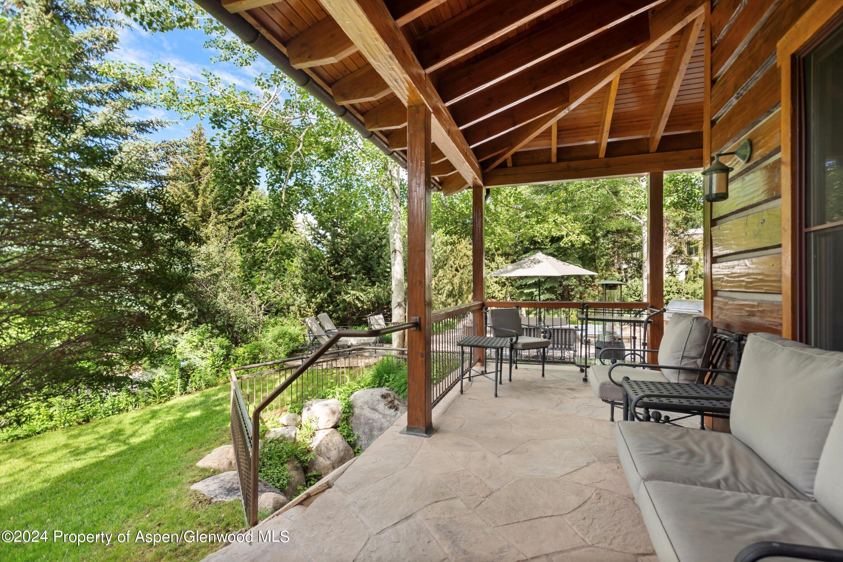27 Nighthawk Drive Aspen, CO 81611 - Photo 10 of 61 a patio with glass top table and chairs
