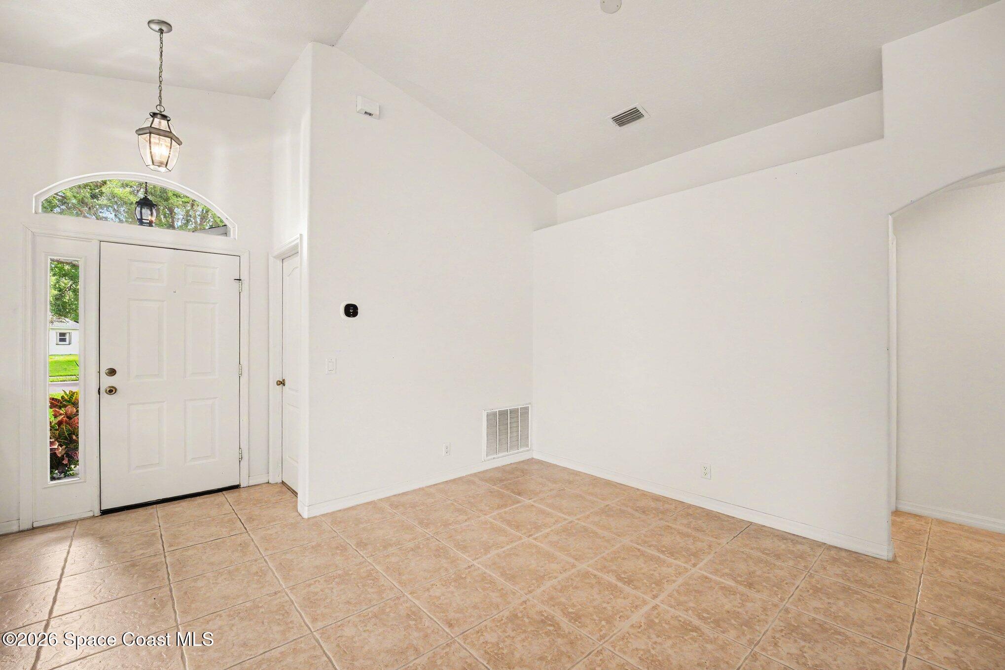 2194 Spring Creek Circle Palm Bay, FL 32905 - Photo 4 of 40 Front Entrance.Dining Area