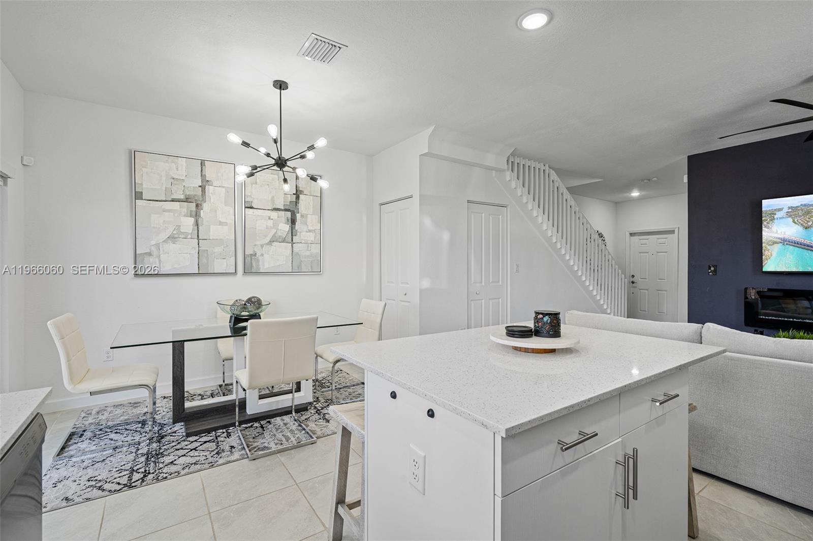 9941 Southwest 231st Lane, Unit 9941 Miami, FL 33190 - Photo 12 of 29 a kitchen with a sink and a refrigerator