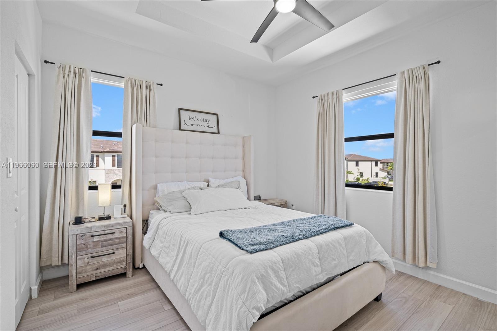 9941 Southwest 231st Lane, Unit 9941 Miami, FL 33190 - Photo 19 of 29 a bedroom with a bed and a closet