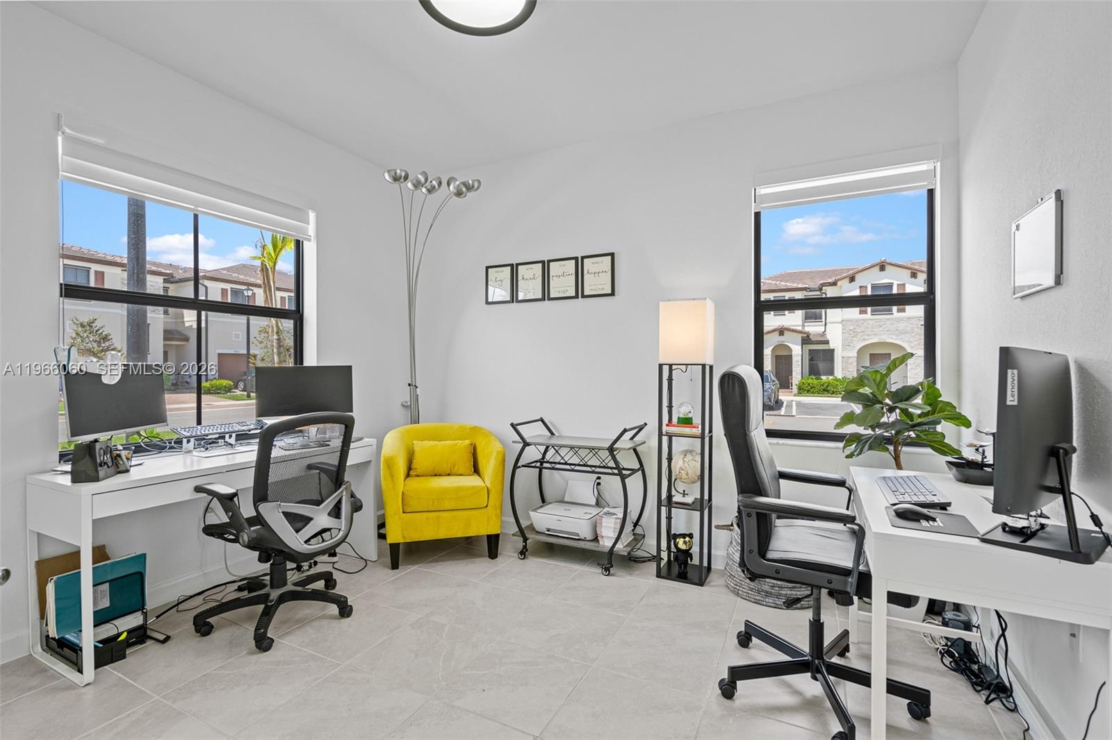 9941 Southwest 231st Lane, Unit 9941 Miami, FL 33190 - Photo 24 of 29 a view of a workspace with furniture and a window