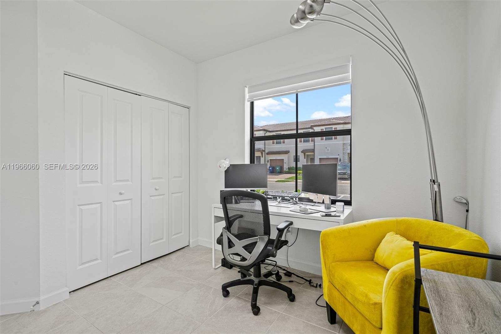 9941 Southwest 231st Lane, Unit 9941 Miami, FL 33190 - Photo 25 of 29 a view of a workspace with furniture