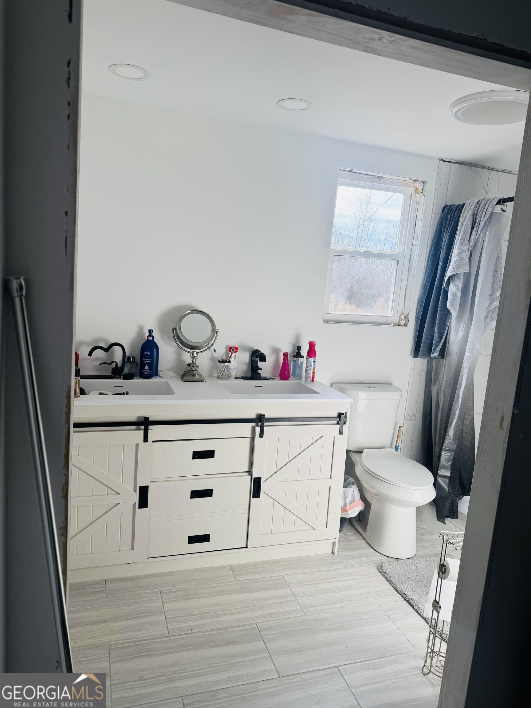 508 McKibben Road Buchanan, GA 30113 - Photo 11 of 20 a bathroom with a sink vanity mirror and toilet