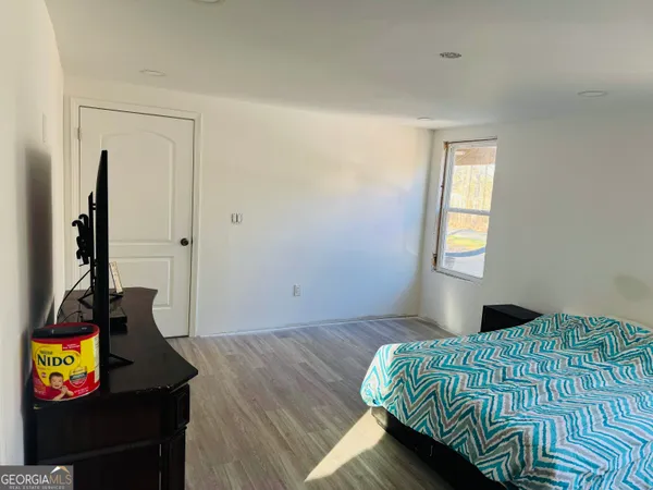 a view of a workspace with furniture and screen