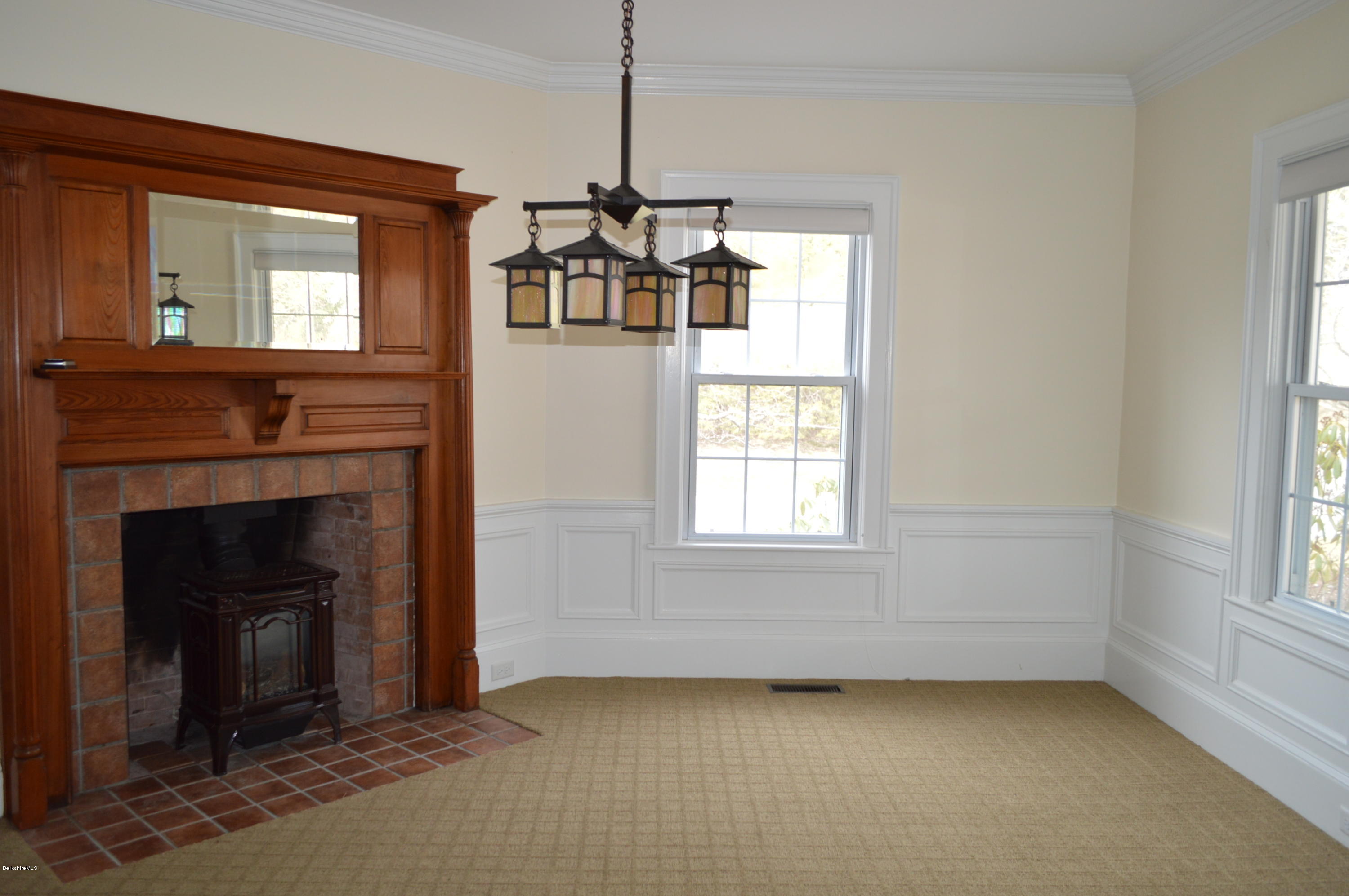 11 Rossiter Road Richmond, MA 01254 - Photo 16 of 40 a view of livingroom with fireplace cabinet and window