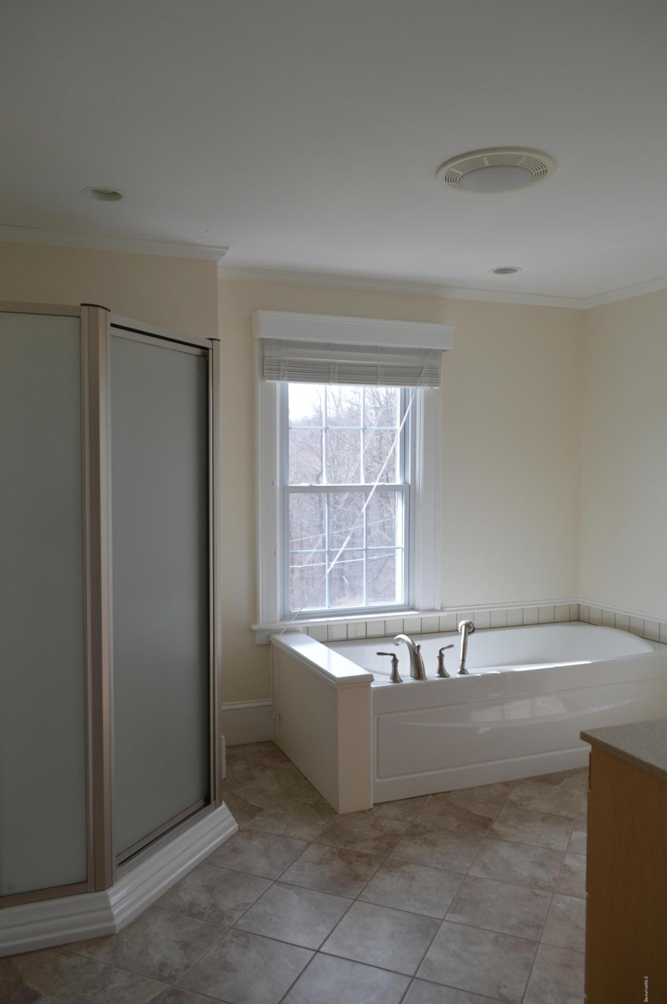 11 Rossiter Road Richmond, MA 01254 - Photo 23 of 40 a bathroom with a bathtub and a window