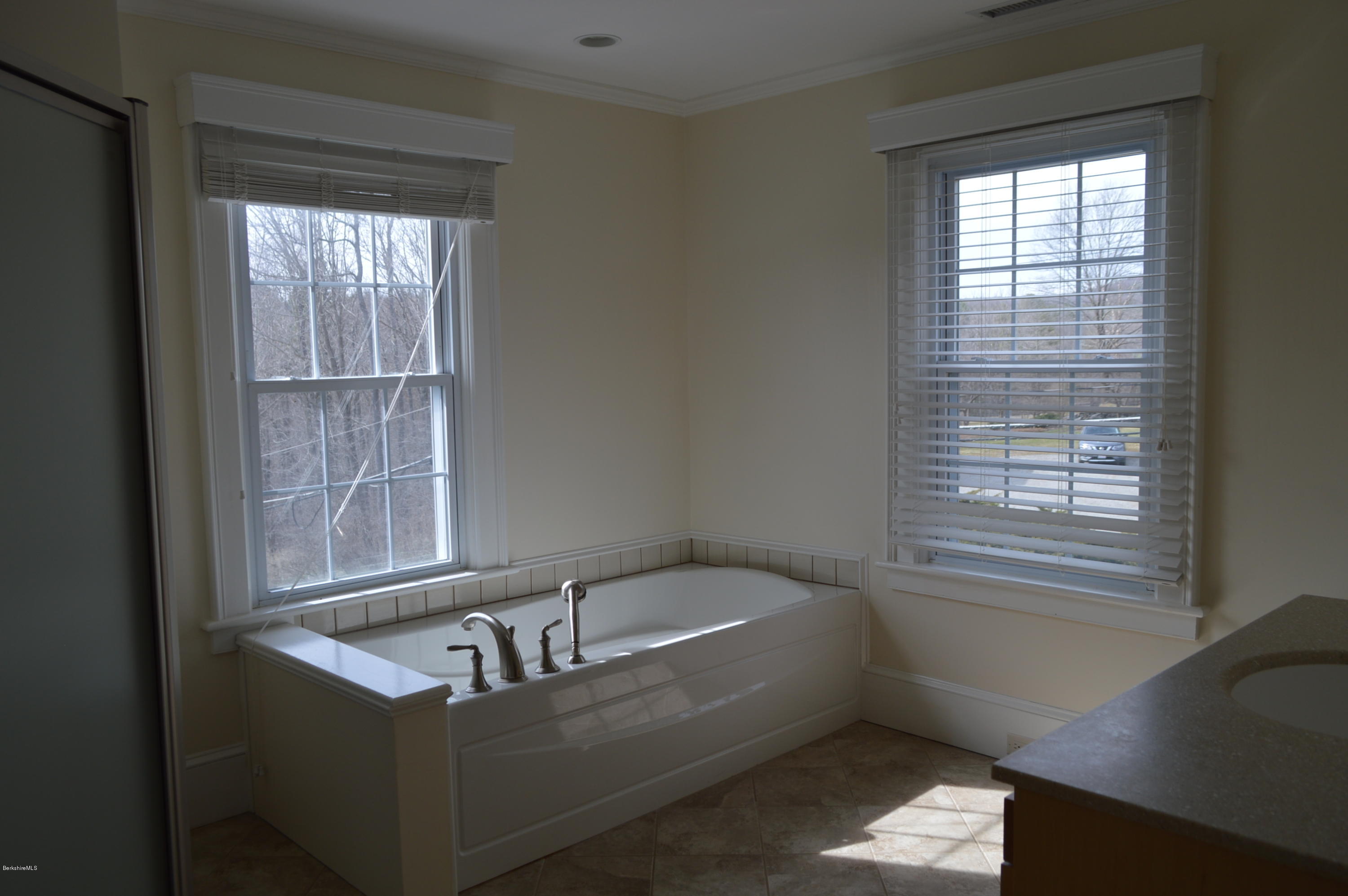 11 Rossiter Road Richmond, MA 01254 - Photo 24 of 40 a bath tub sitting in a bathroom next to a window