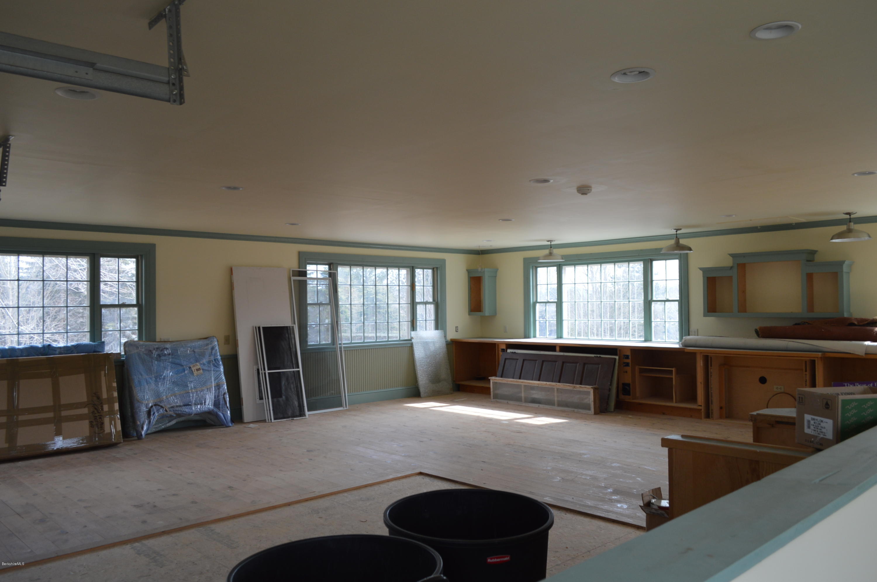 11 Rossiter Road Richmond, MA 01254 - Photo 38 of 40 a large living room with granite countertop furniture a flat screen tv and windows