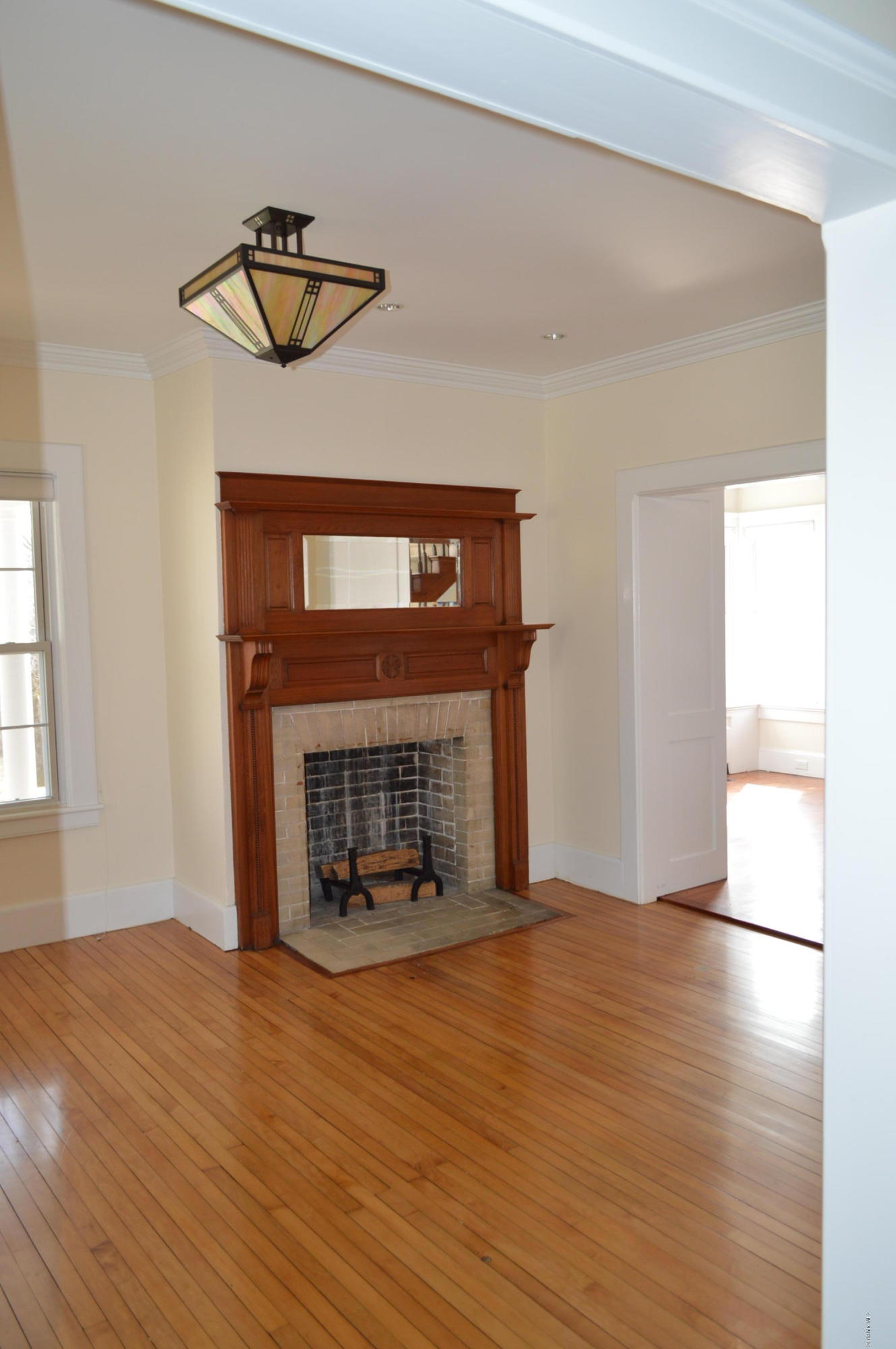 11 Rossiter Road Richmond, MA 01254 - Photo 9 of 40 a view of an empty room with wooden floor fireplace and a window