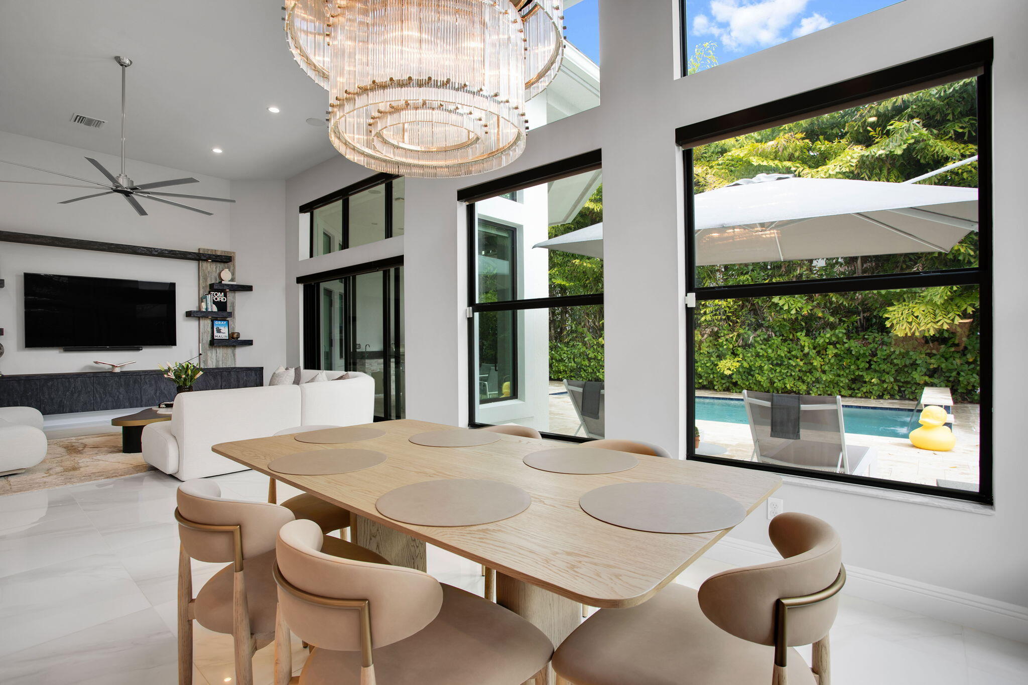6903 Northwest 28th Avenue Boca Raton, FL 33496 - Photo 14 of 55 a living room with furniture and a flat screen tv
