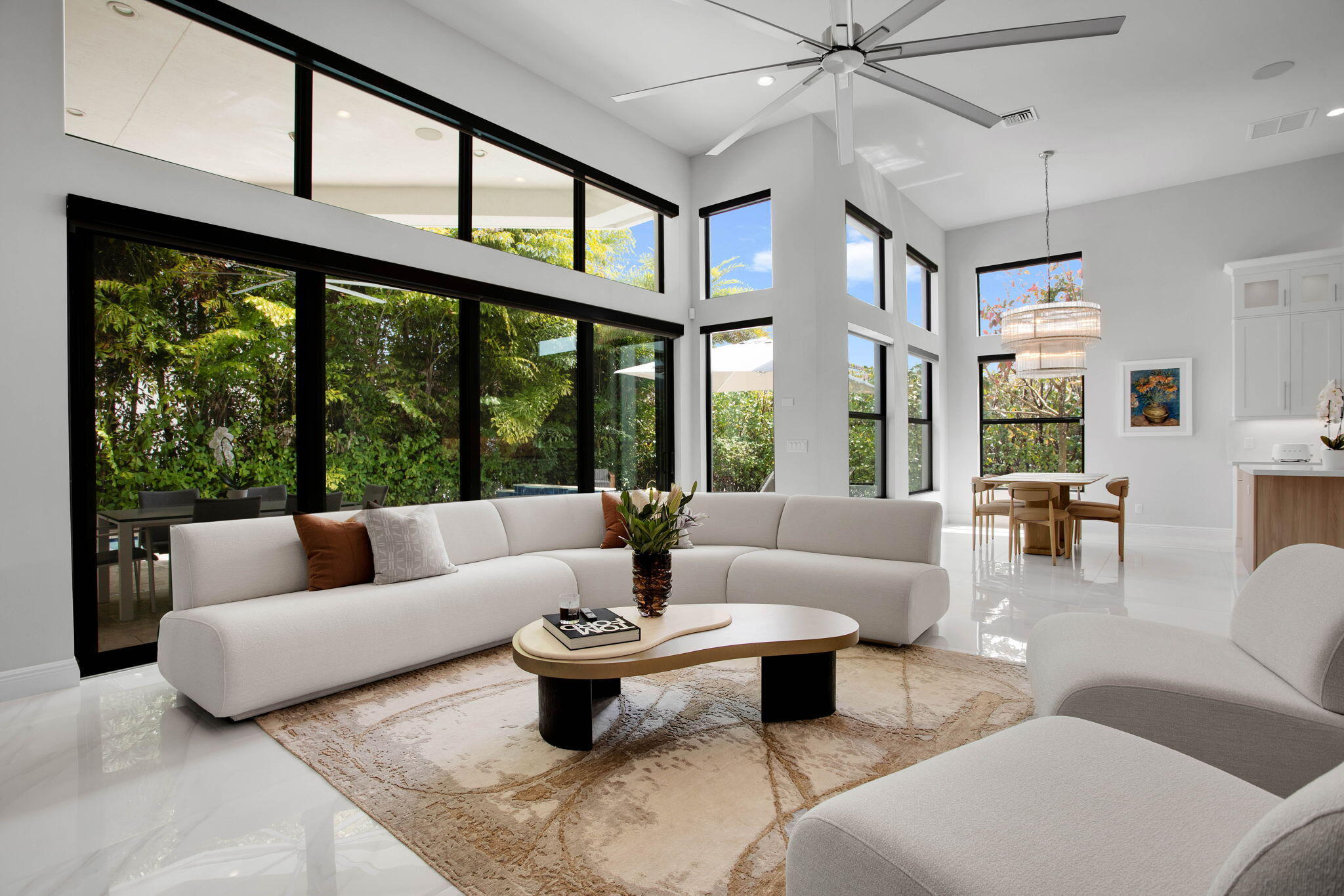6903 Northwest 28th Avenue Boca Raton, FL 33496 - Photo 16 of 55 a living room with furniture and large windows