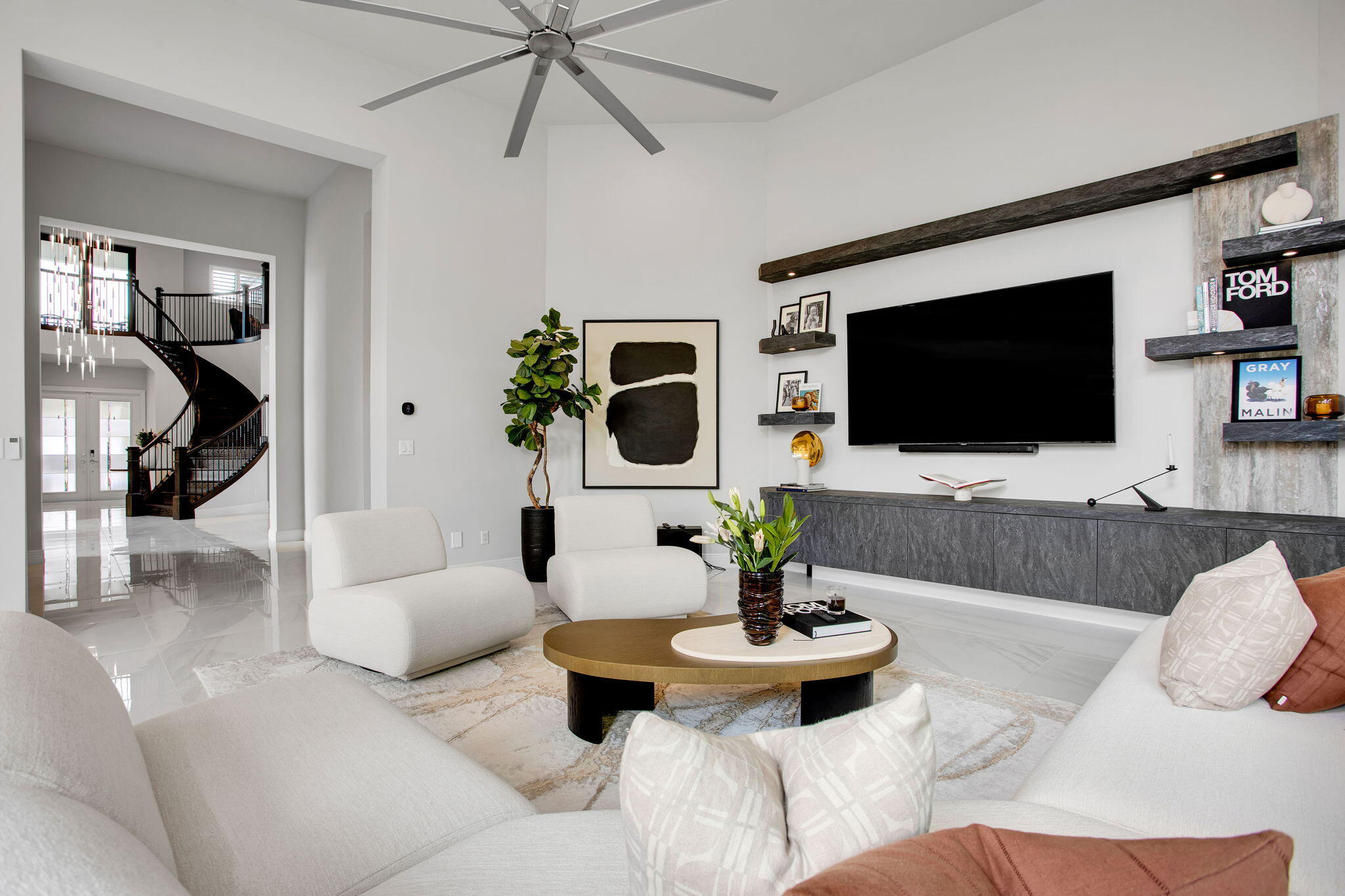 6903 Northwest 28th Avenue Boca Raton, FL 33496 - Photo 18 of 55 a living room with furniture and a flat screen tv